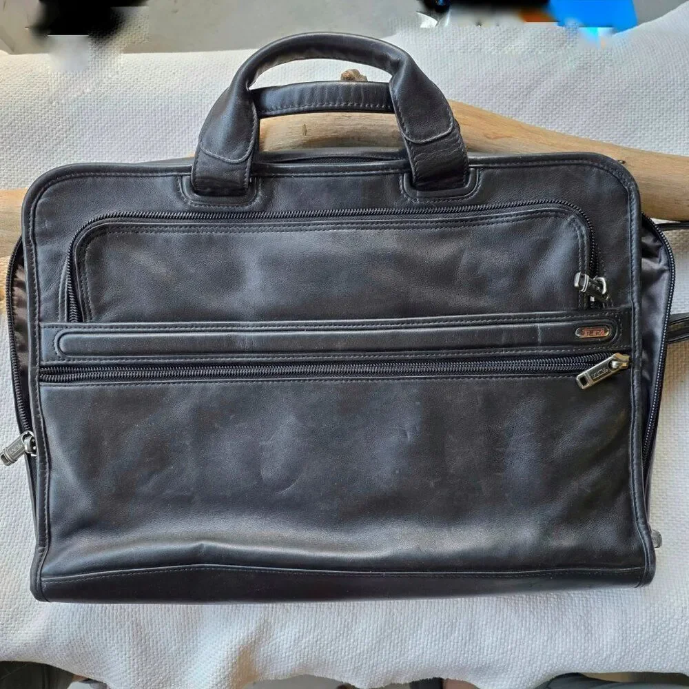 Tumi black leather briefcase